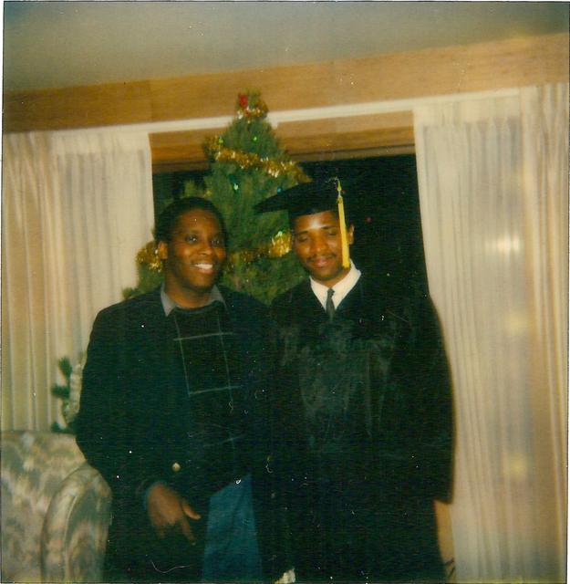 Graduation day in front of the Christmas tree