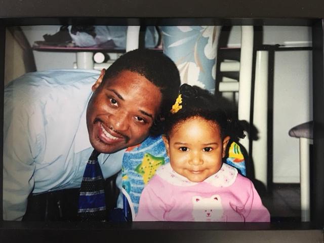 Father and daughter smiling together