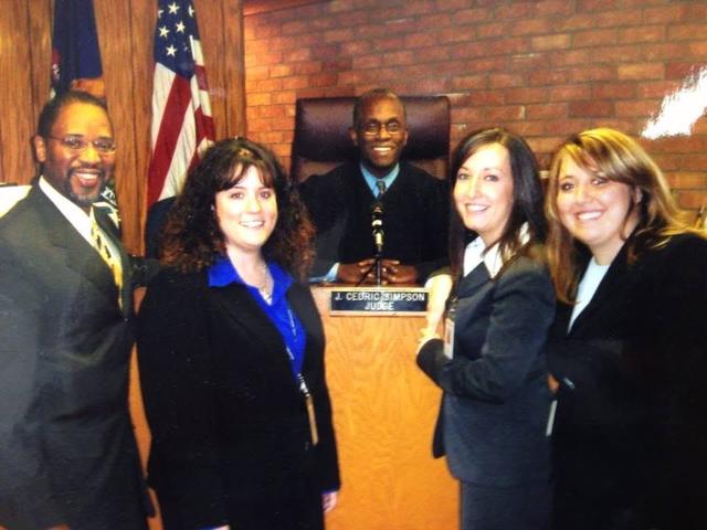 Group photo at a judge’s bench