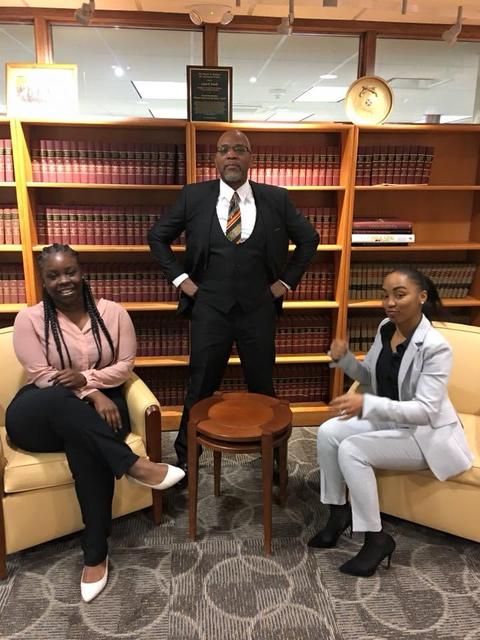 Professional portrait in an office with law books