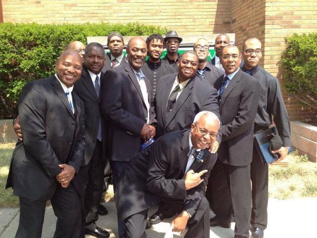 Fraternity brothers in suits outdoors