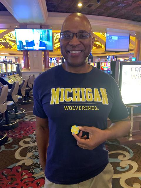 Wearing a Michigan Wolverines shirt