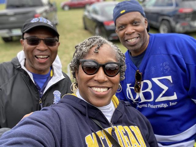 Selfie with friends in Michigan and Phi Beta Sigma gear