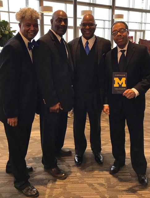 Friends in suits at an event