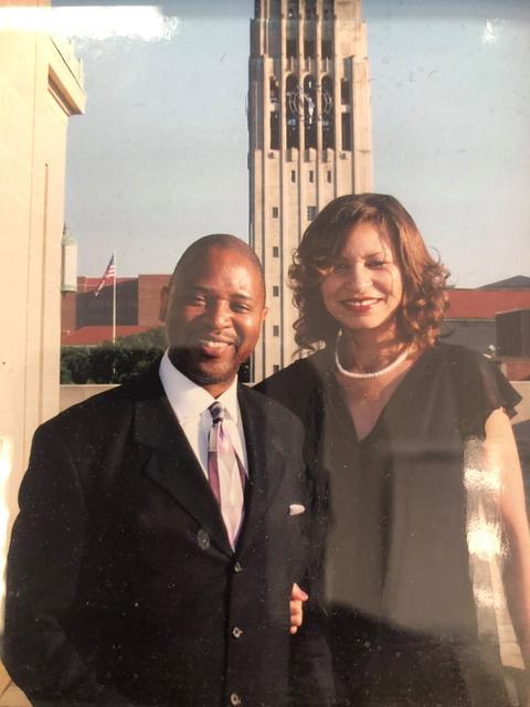 Couple in front of a clock tower