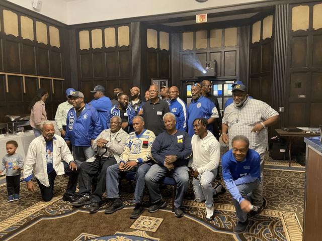 Large group photo in blue and white